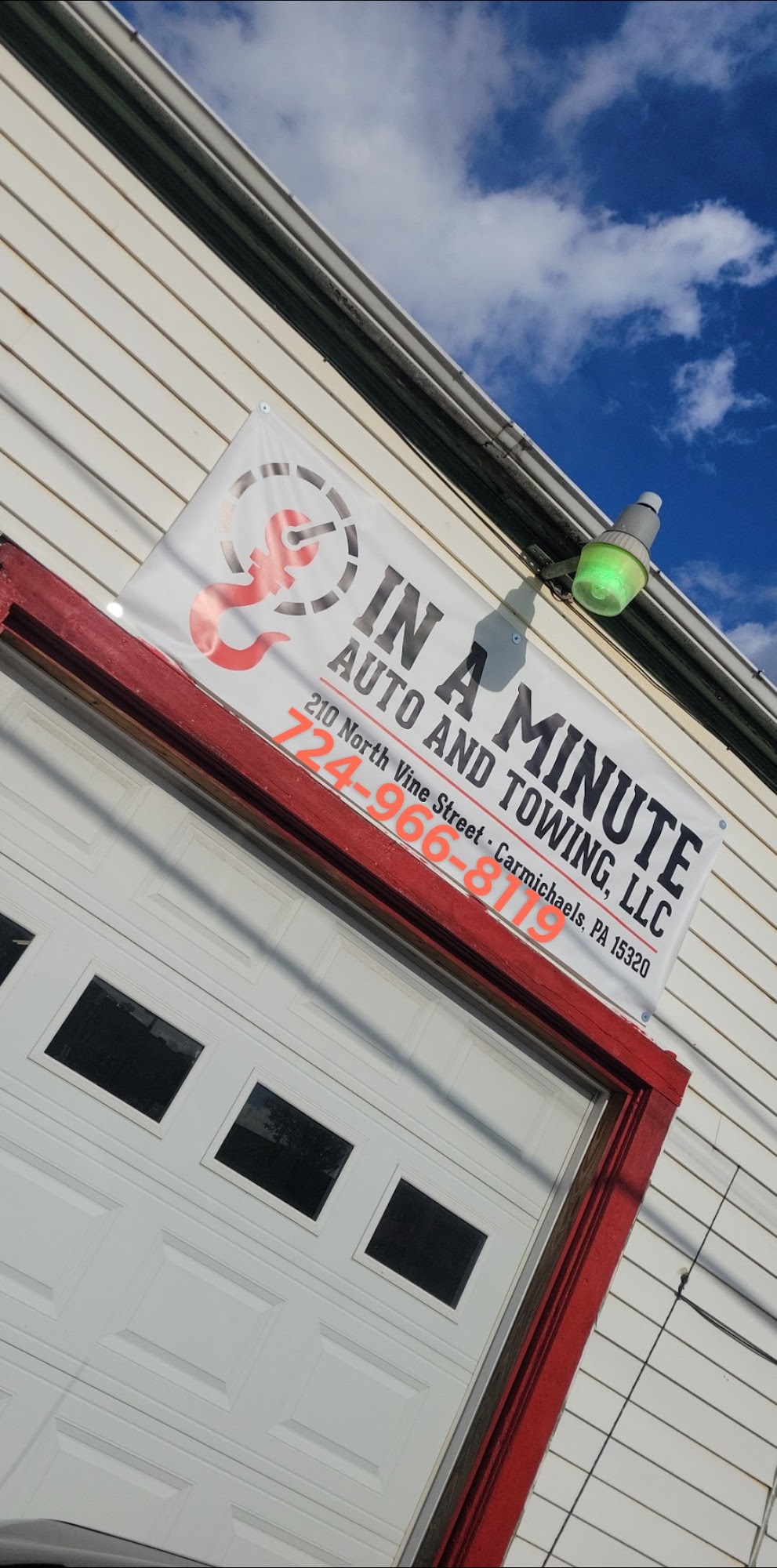 In A Minute Auto & Towing LLC